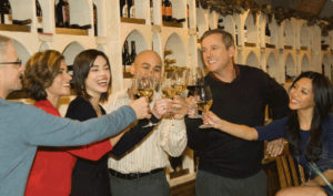group of friends at winestyles toasting