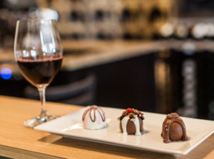 wine glass with chocolate truffles image